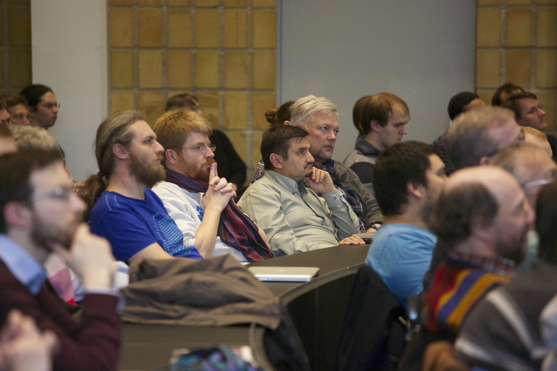a closeup of the audience, particularly Poul-Henning
        Camp, listening to the lecture